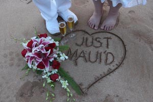 Maui wedded couple in the sand